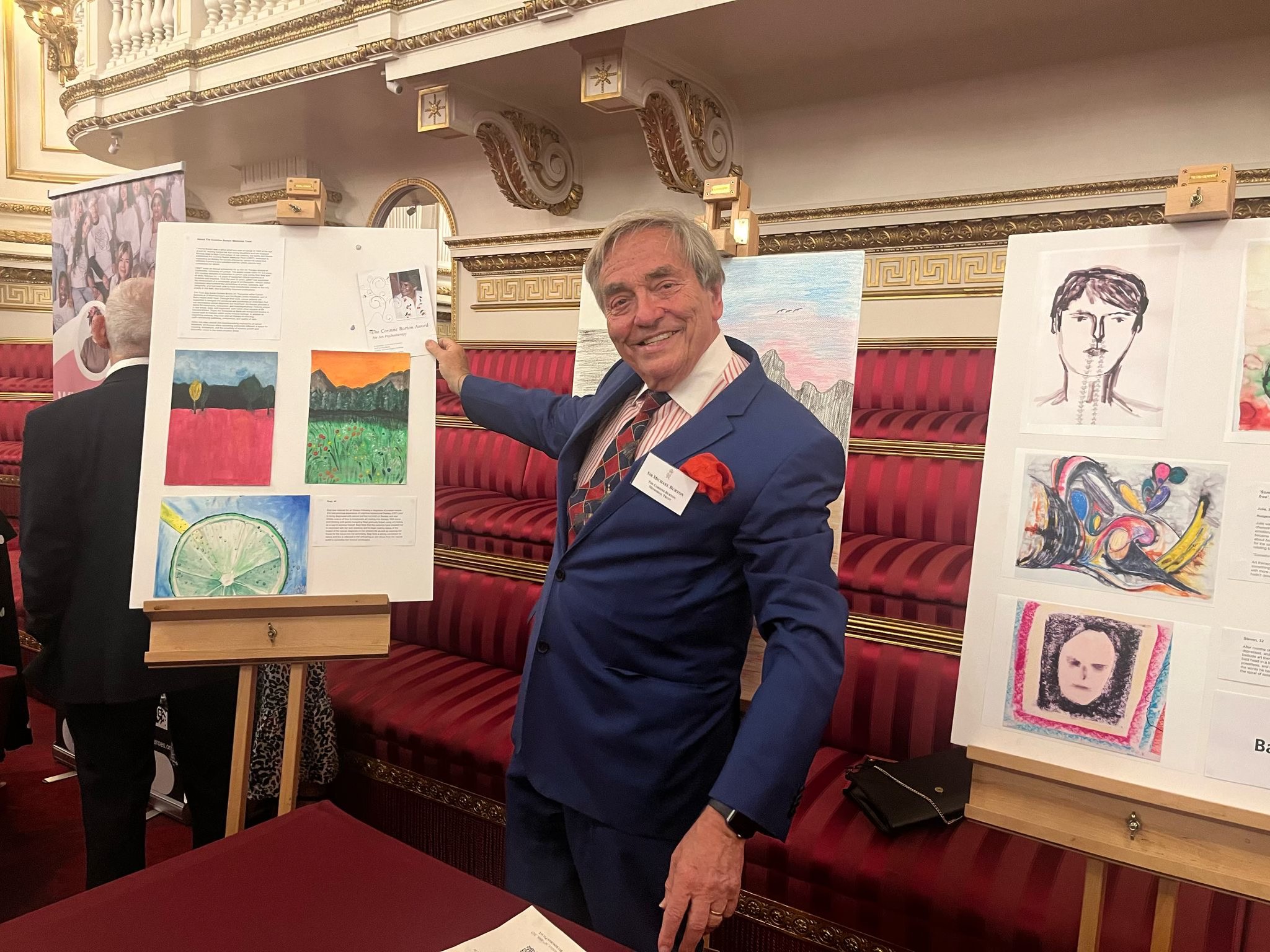 Sir Michael Burton with CBMT's display in the Throne Room at Buckingham Palace